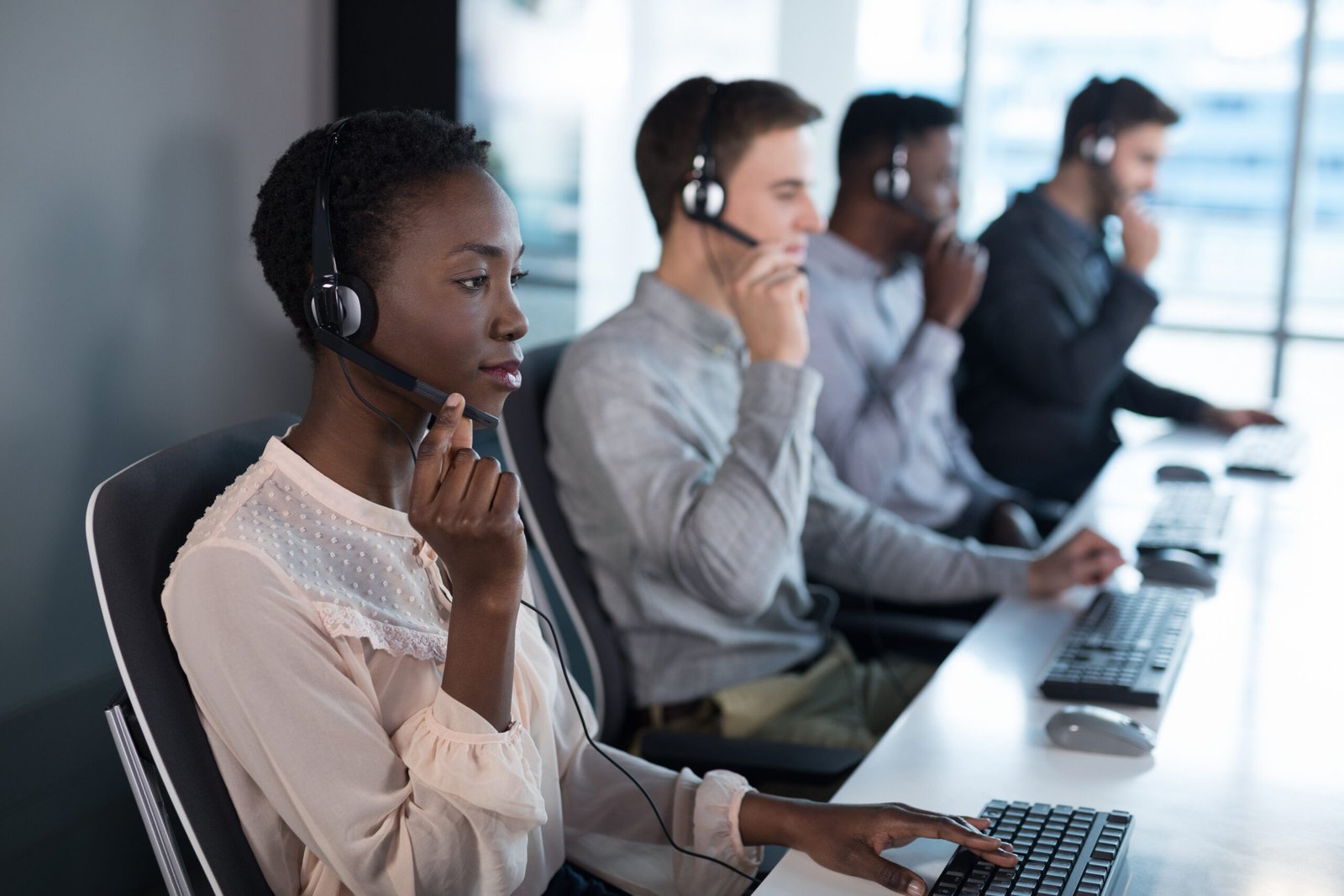 Attentive customer service executives working at office